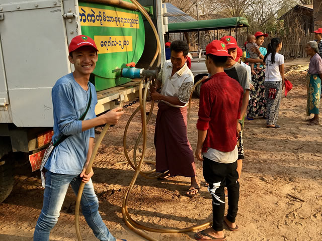 Student helping with local water supply